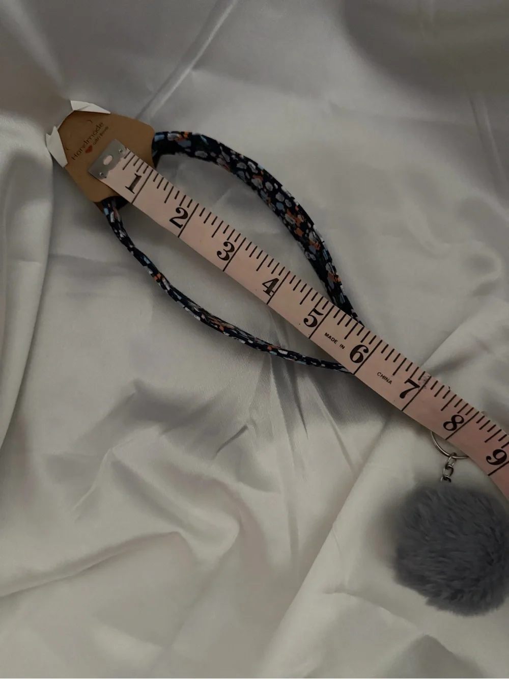 Handmade Blue and Orange Floral Wristlet Keychain with Gray Pompom